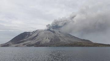 Smoke is still spewing from Indonesia's Ruang volcano after the latest lava eruption. (AP PHOTO)