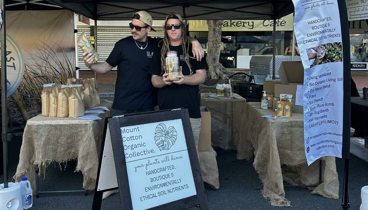 Cameron Eddy and Jarryd Goode of the Mount Cotton Organic Collective at their Cleveland Markets stall. Picture supplied
