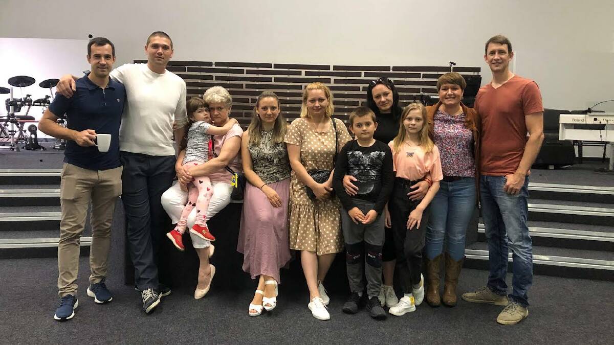 HAPPY FAMILY: Maxim (second from left) and his family have been welcomed into Australia after they fled their home in Kherson Oblast. Picture: Lena McInnes.