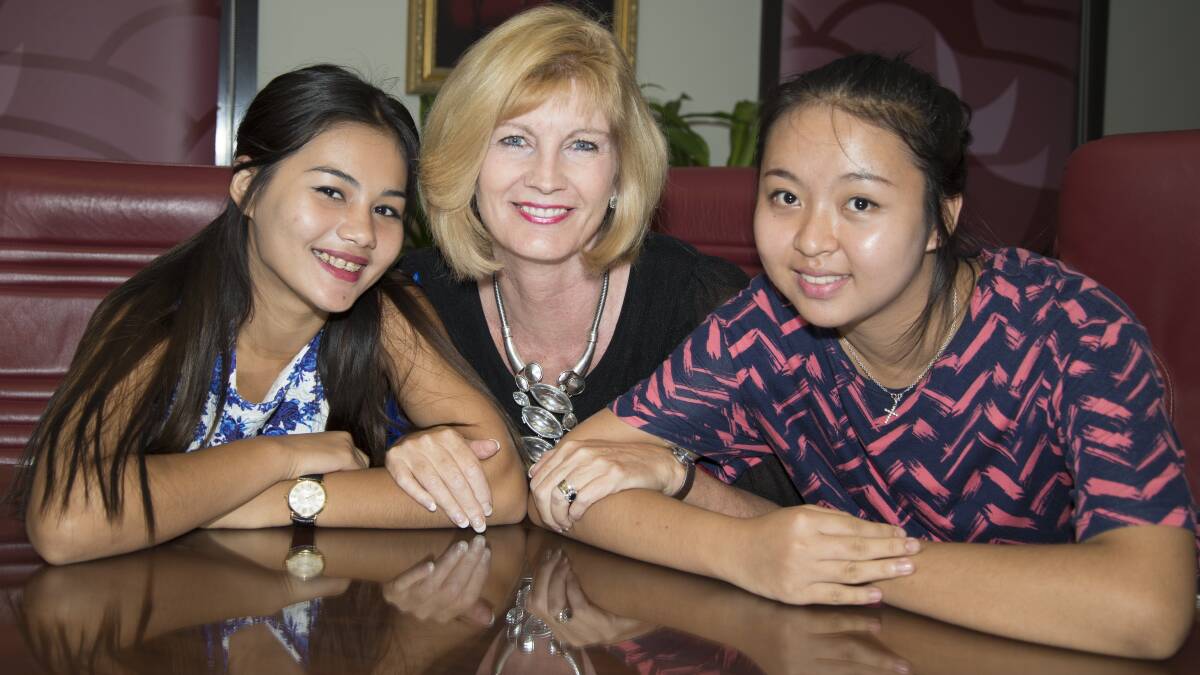A STEP UP: Mayor Pam Parker with July Soe (left) and Blessing Htoo.