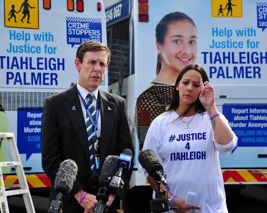APPEAL: Tiahleigh's mum Cyndi Palmer with Superintendent David Hutchinson at the launch of the bus wrap campaign in Park Ridge on Sunday. Photo: supplied