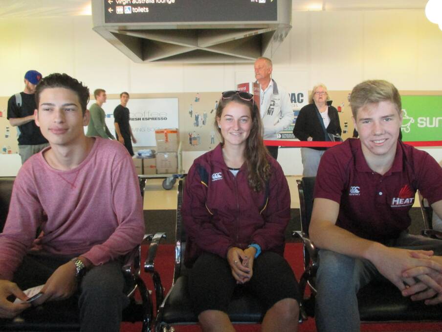 READY: Mitchell Fekete, Camryn Newton-Smith and Ashley Moloney wait at the airport last week before flying to Canberra for the Australian Institute of Sport camp.