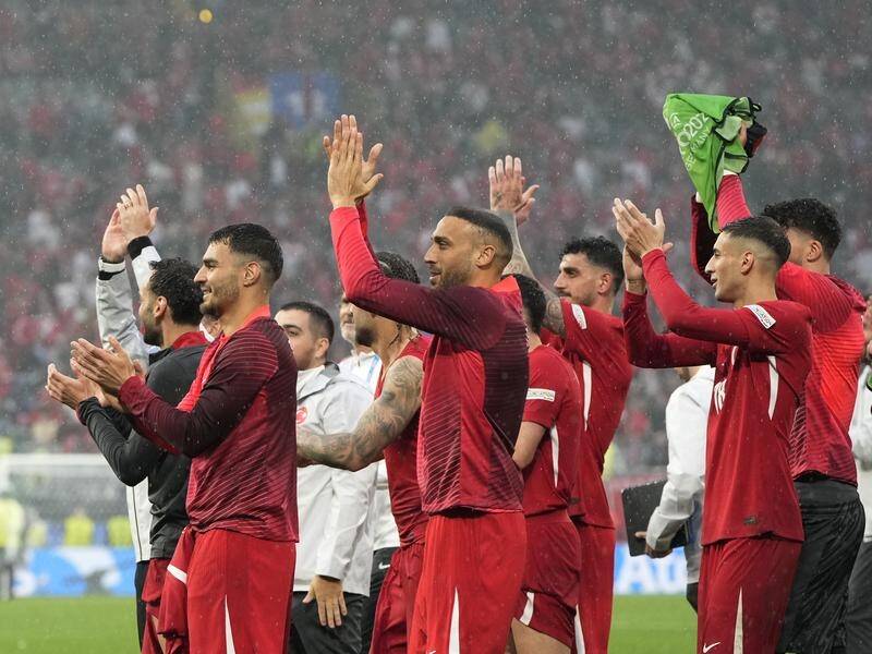 Turkey's players celebrate after beating Georgia at Euro 2024. (AP PHOTO)