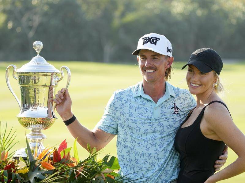 Jake Knapp celebrates his maiden PGA Tour win in Mexico with his girlfriend Makena White. (AP PHOTO)