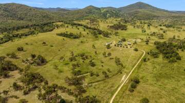 The scenic 2034 acre freehold property in the Mount Tom district features a mixture of open paddocks and timbered grazing country. Picture suppleid