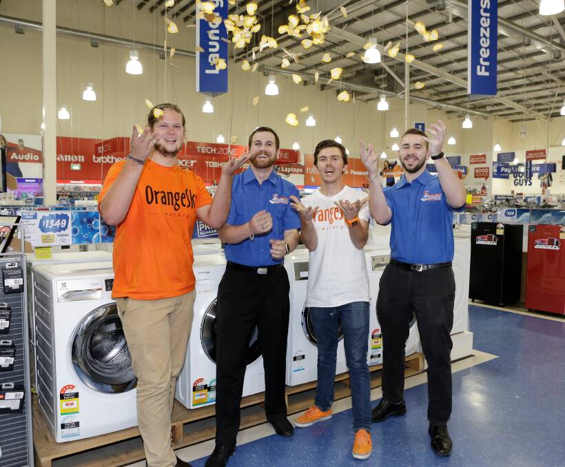 NOMINATE: Orange Sky Laundry founders, Lucas Patchett and Nicholas Marchesi, and The Good Guys team members celebrate the launch of The Good Guys’ Dryers for Communities initiative. Photo: Supplied