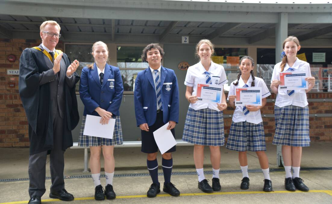AWARDED: Principal Kevin Lynch with academic honour with distinction winners, year 12 student Emily Cooper, year 11 student Jayron Gray and year 9 students Lauren Turner, Chantelle Tray, Taleaha Dempsey. Photo: Supplied